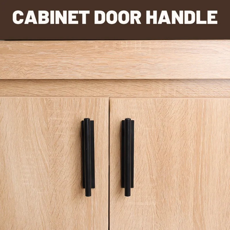 Close-up of two black cabinet door handles on a light wood cabinet drawer.