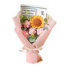 A handmade sunflower daisy crochet bouquet wrapped in pink paper with a card that reads I love you more than can say