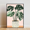 Botanical Philodendron canvas wall art featuring large green leaves on a pink background.
