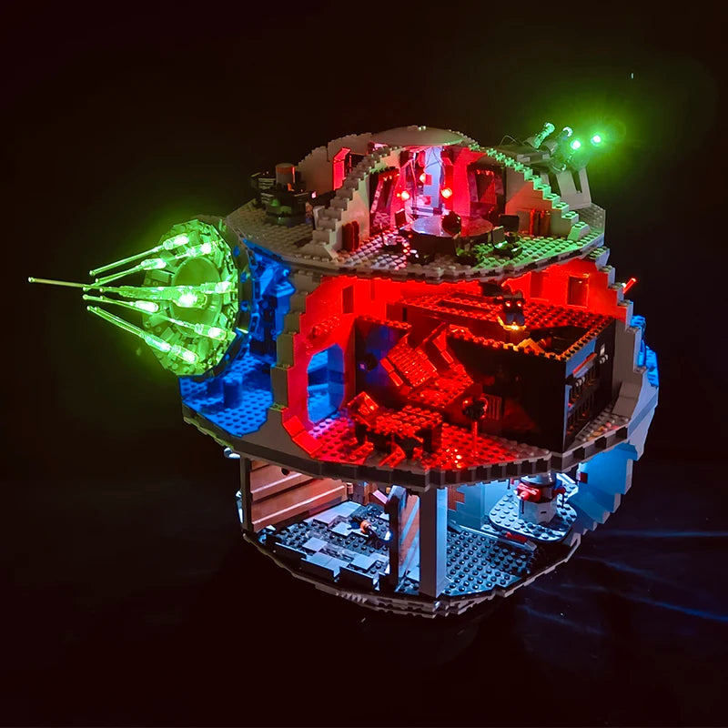 A model of the Death Star building set illuminated with green and red LED lights.