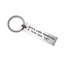Silver stainless steel keychain engraved with the message Drive safe I love you handsome.