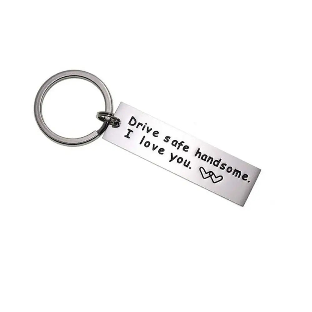 Silver stainless steel keychain engraved with the message Drive safe I love you handsome.