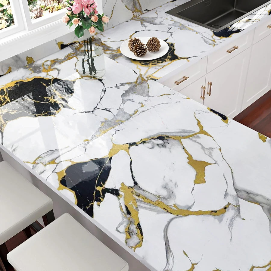 Marble white and gold kitchen countertop featuring marble patterns and gold accents