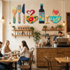 A rustic wood floral kitchen decor set displayed on shelves above a wooden counter in a cafe setting.