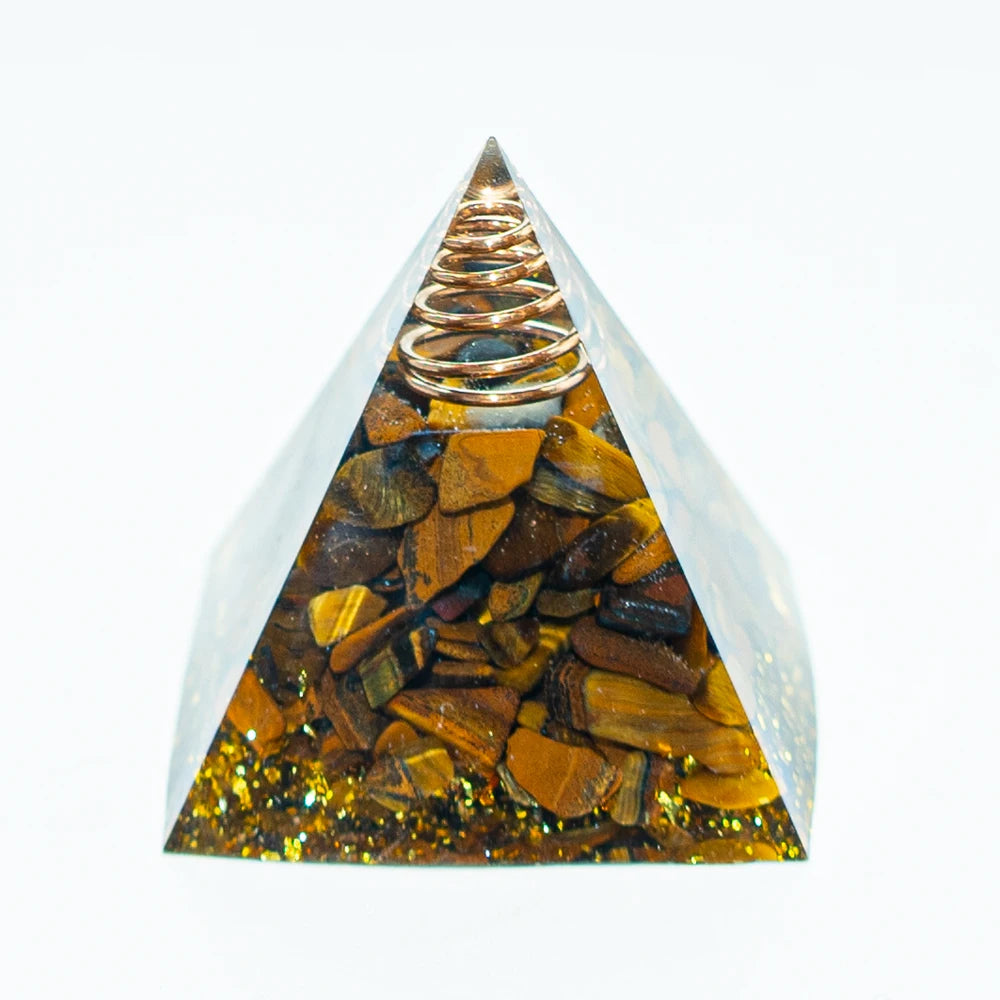 Amethyst crystal energy pyramid with a coil at the apex, set in a clear glass structure.