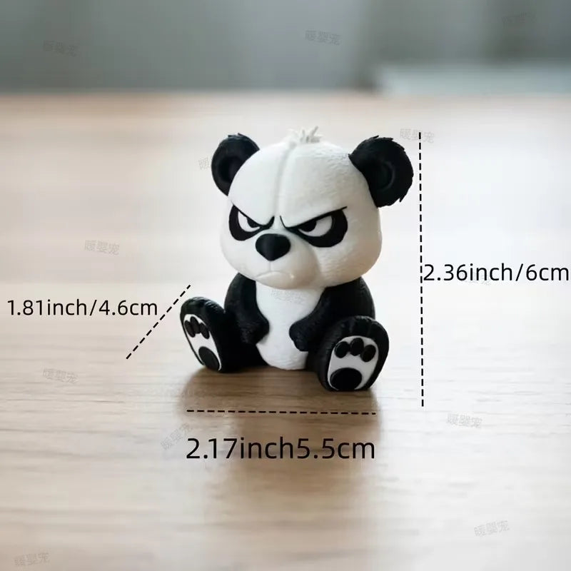 A cute angry panda figurine with black and white fur sitting on a wooden surface.