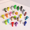 A collection of colorful handcrafted musical figurines featuring various animal and abstract shapes.