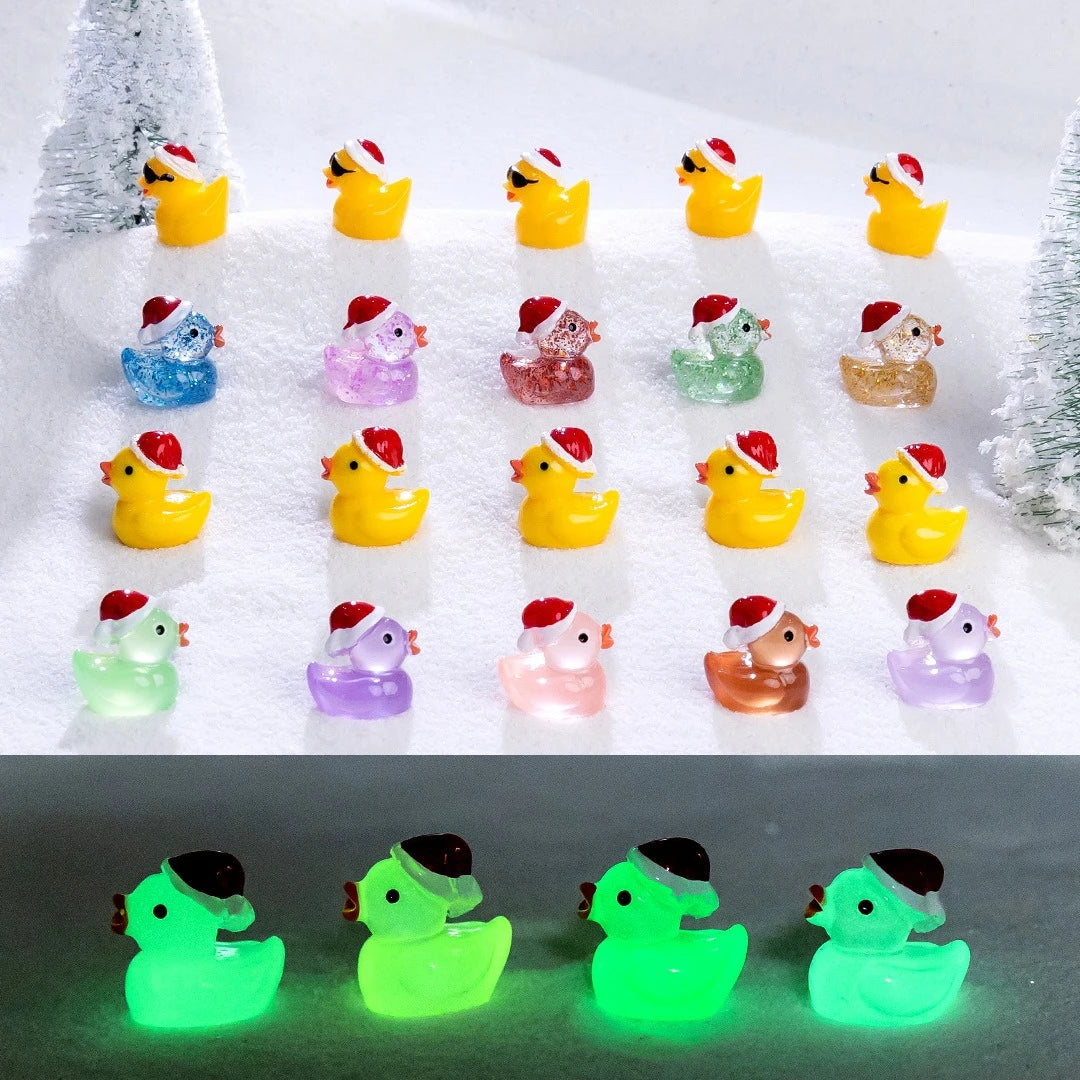 A collection of glow-in-the-dark duck figurines wearing Santa hats arranged in a row.