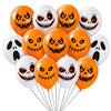 A bunch of Halloween-themed latex balloons featuring spooky, grinning skull faces in orange and white.