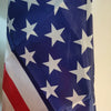 A close-up of the American flag fabric featuring white stars on a blue field and red and white stripes.