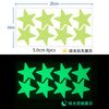 A set of eight glow-in-the-dark yellow stars for wall decoration, showing both daytime and nighttime illumination.