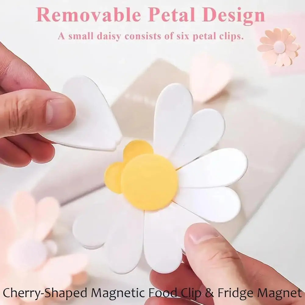Clip magnético en forma de cereza y imán para nevera con diseño de margarita blanca.