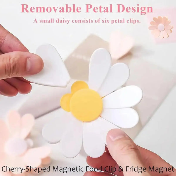 Cherry-shaped magnetic food clip and fridge magnet featuring a white daisy design.