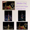 A set of four scratch paper cards and one wooden pen for a Modern City themed DIY painting art kit.