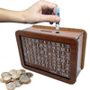 A wooden piggy bank filled with coins and a hand holding a coin, demonstrating its capacity for saving goals.
