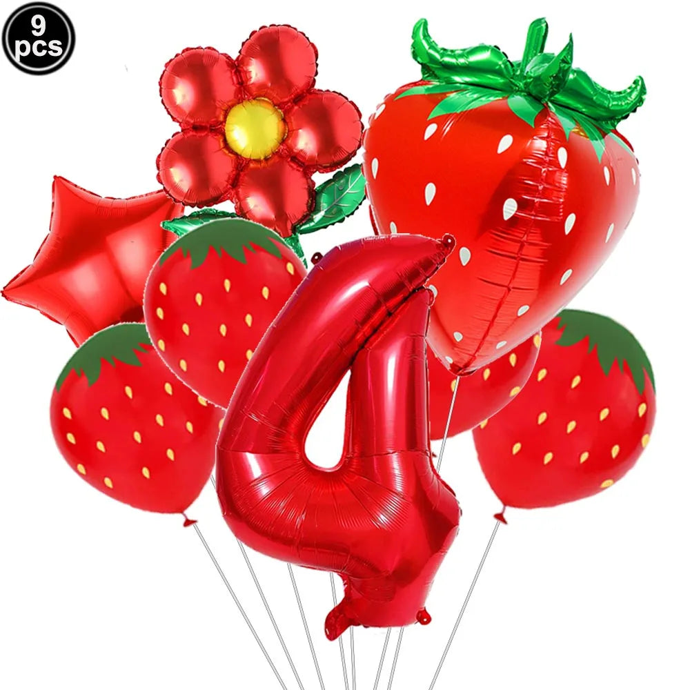 A set of red strawberry shaped balloons and number balloons for a party kit