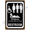 A vintage metal sign with a black background and white text instructing people to wash their hands in the restroom.