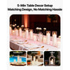 A set of glass cylinder vases with pillar candles displayed on a table setting for home decor and events.