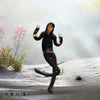 A collectible plush doll of Michael Jackson in a black outfit posing on a snowy surface.