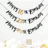 Elegant black and gold glitter birthday banner with numbers 16, 21st, and 40th hanging against a white background.