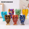 A collection of natural crystal guardian angel figurines in various colors including blue, purple, green, and yellow.