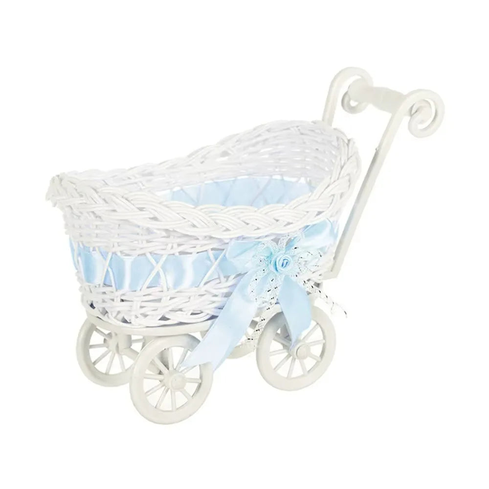 White faux rattan woven storage basket with a light blue ribbon and handle