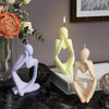 A set of abstract silicone molds shaped like figures and candles for resin art and crafting