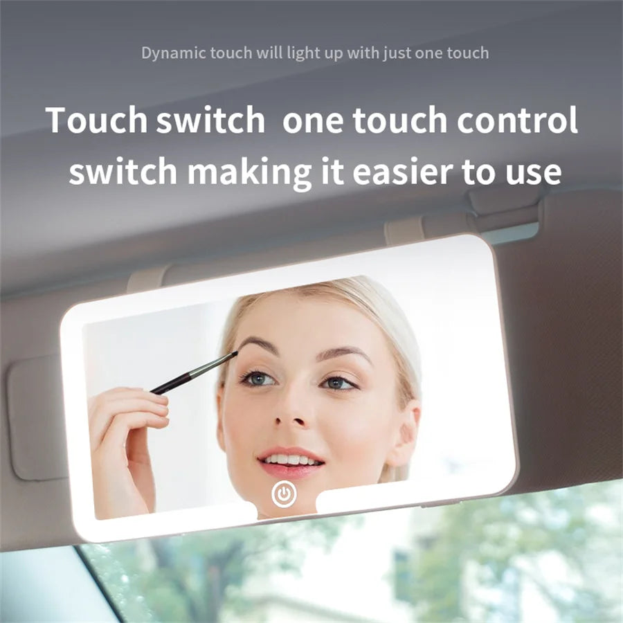 A car sun visor vanity mirror with an LED light showing a woman's face.