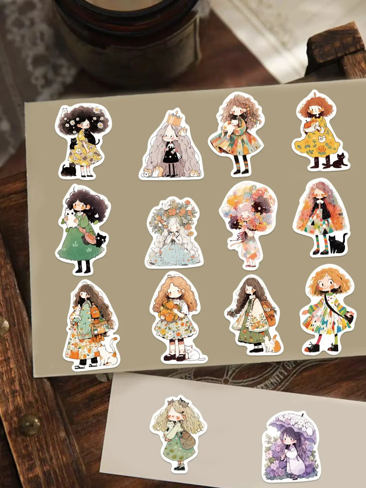 A collection of 12 cute doodle stickers featuring various characters in colorful outfits and styles on a beige background.
