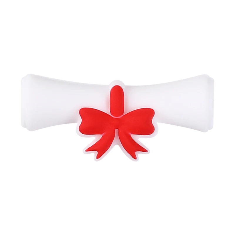 A white silicone plant bead with a red bow attached for jewelry making and DIY crafts.