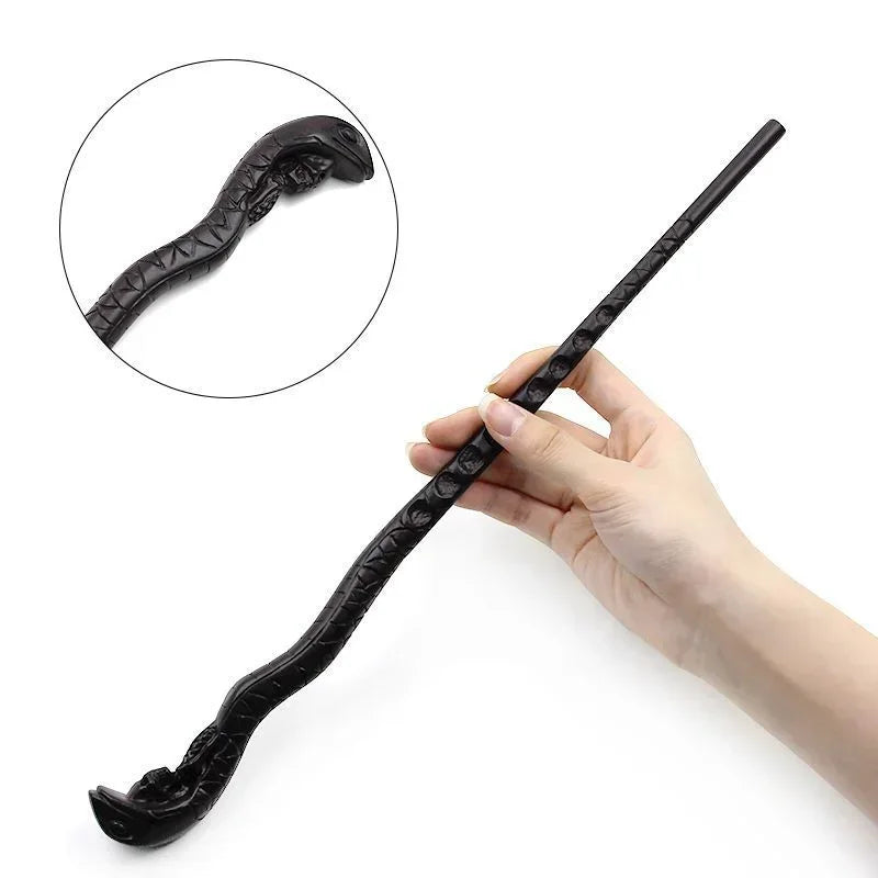 A hand holds a black, serpentine metal-resin magic wand with a curved tip.
