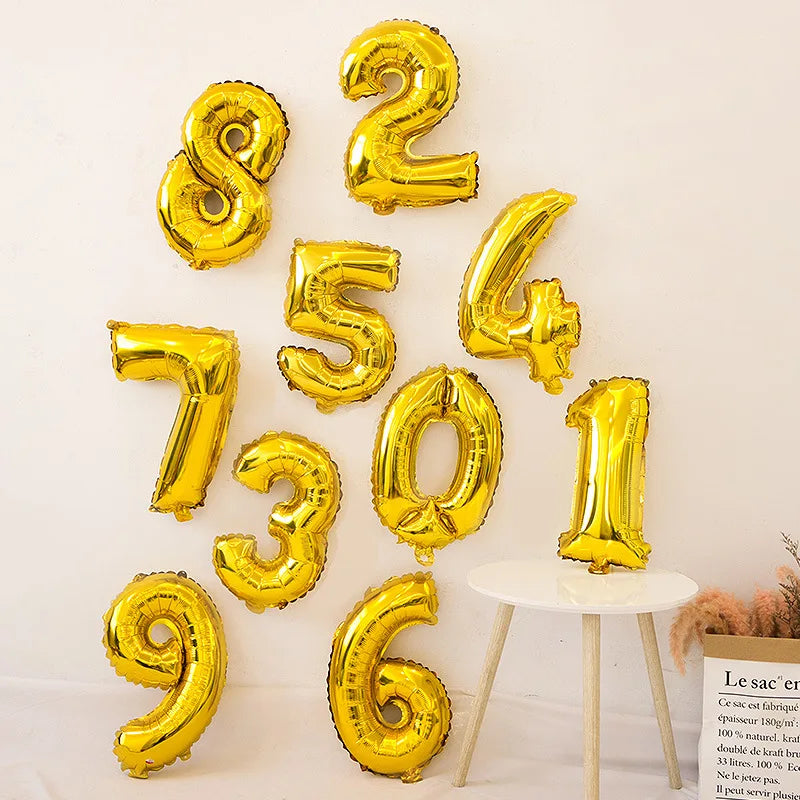 A collection of gold foil number balloons spelling out 8247306