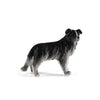 A realistic figurine of a black and gray dog.