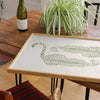 A canvas print set featuring sage green cheetah and pool ball designs displayed on a wooden table.