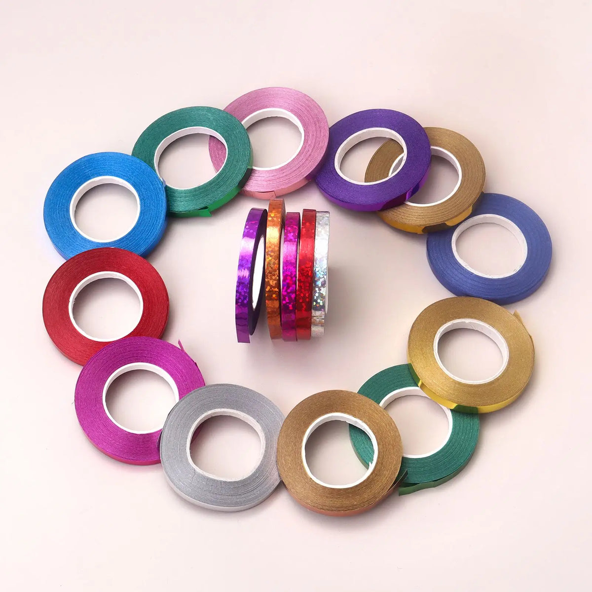 A circular arrangement of various colored satin balloon ribbon rolls.