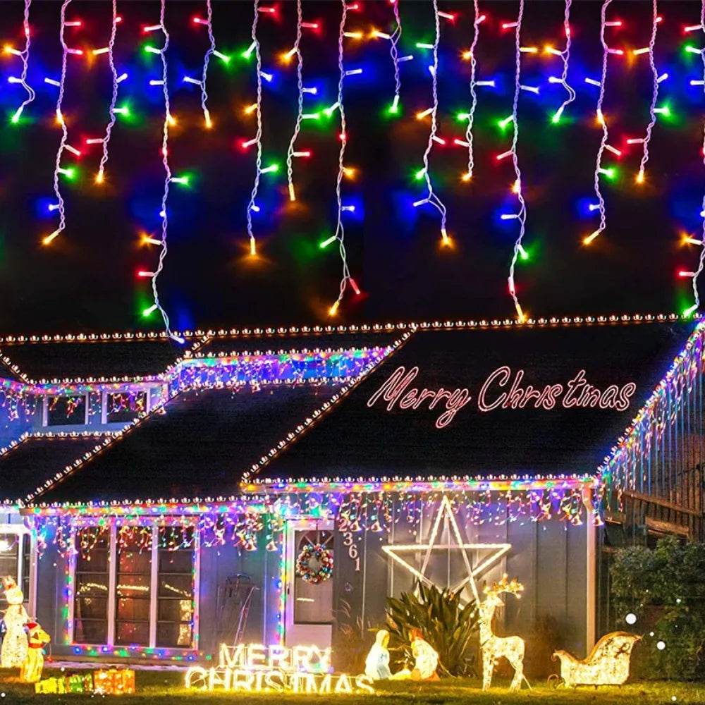 Christmas lights draped like waterfalls across a house facade decorated for the holiday season.