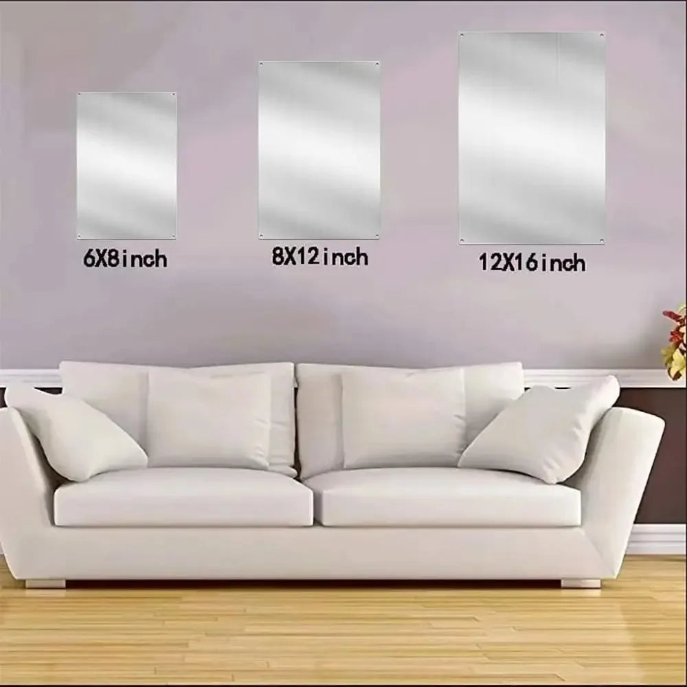 A row of three rectangular silver aluminum wall decor signs in different sizes mounted on a light purple wall above a white s