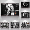 A collection of framed movie posters featuring characters and scenes from The Godfather film.