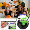 A black Halloween witch hat and a green pumpkin-themed gift bag with bats and skulls.