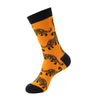 Orange crew socks with black cuff featuring repeating tiger print patterns.