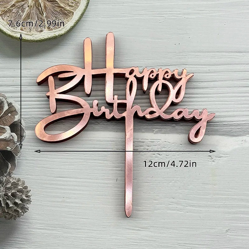 A rose gold acrylic birthday cake topper set spelling out Happy Birthday
