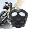 A black skull full face motorcycle mask with a windproof lens is shown in motion against a light background.