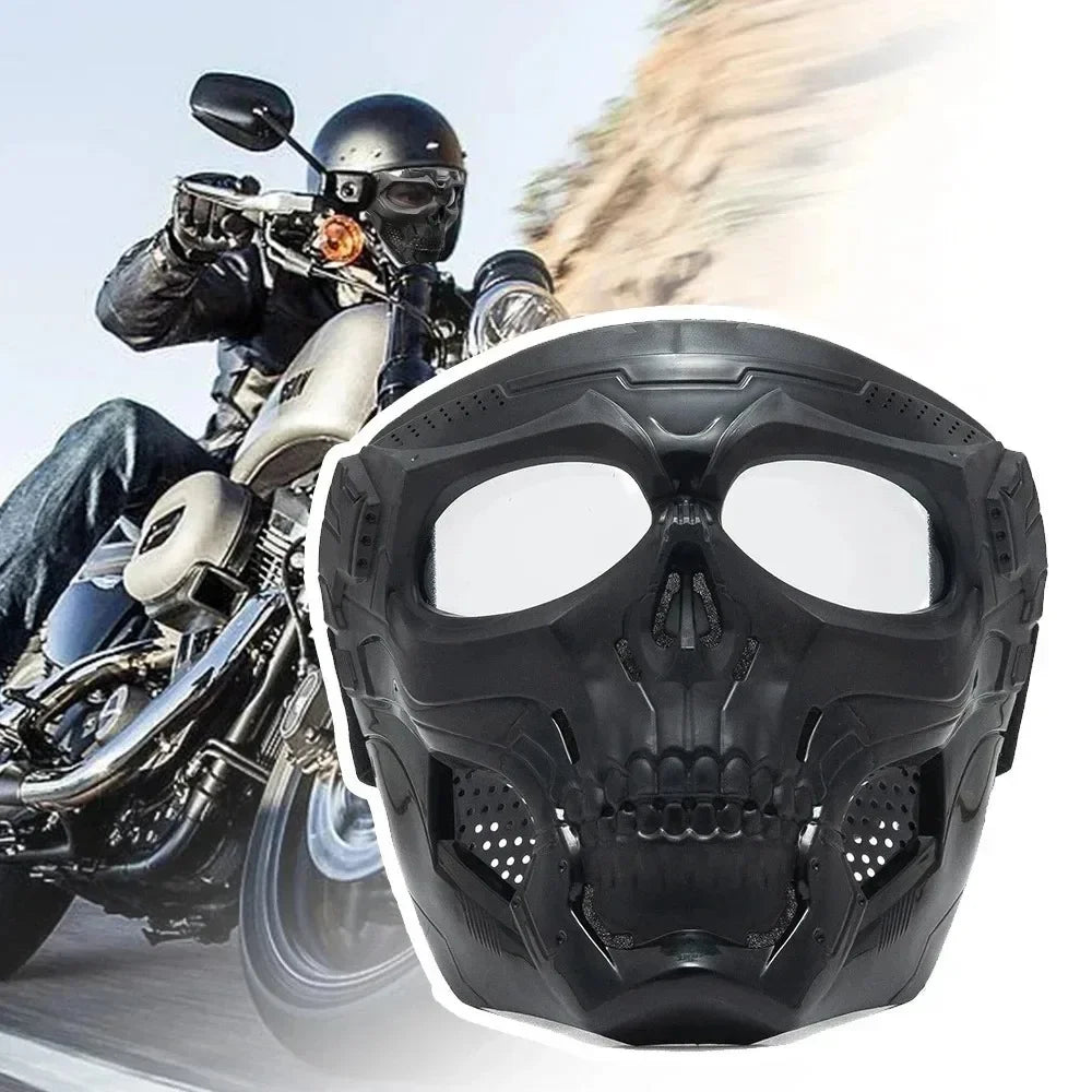 A black skull full face motorcycle mask with a windproof lens is shown in motion against a light background.