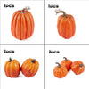 A set of seven small, orange artificial pumpkins for fall and Halloween decoration.