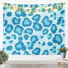 A light blue leopard print tapestry wall hanging decorated with string lights.