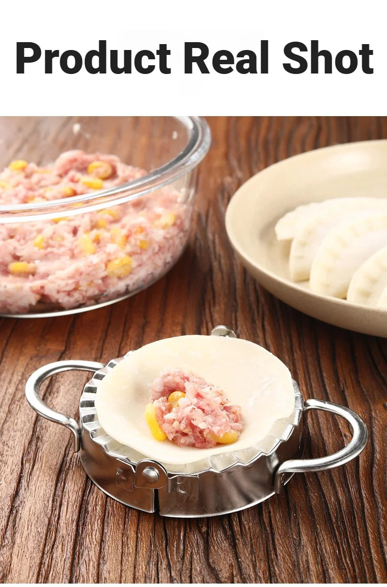 A close-up of a stainless steel dumpling maker with a crimped edge, holding pink meat filling.