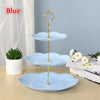 Blue three-tier detachable cake stand for desserts and fruit with gold accents