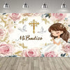 A floral backdrop for a First Communion featuring a gold cross and doves with a young girl.