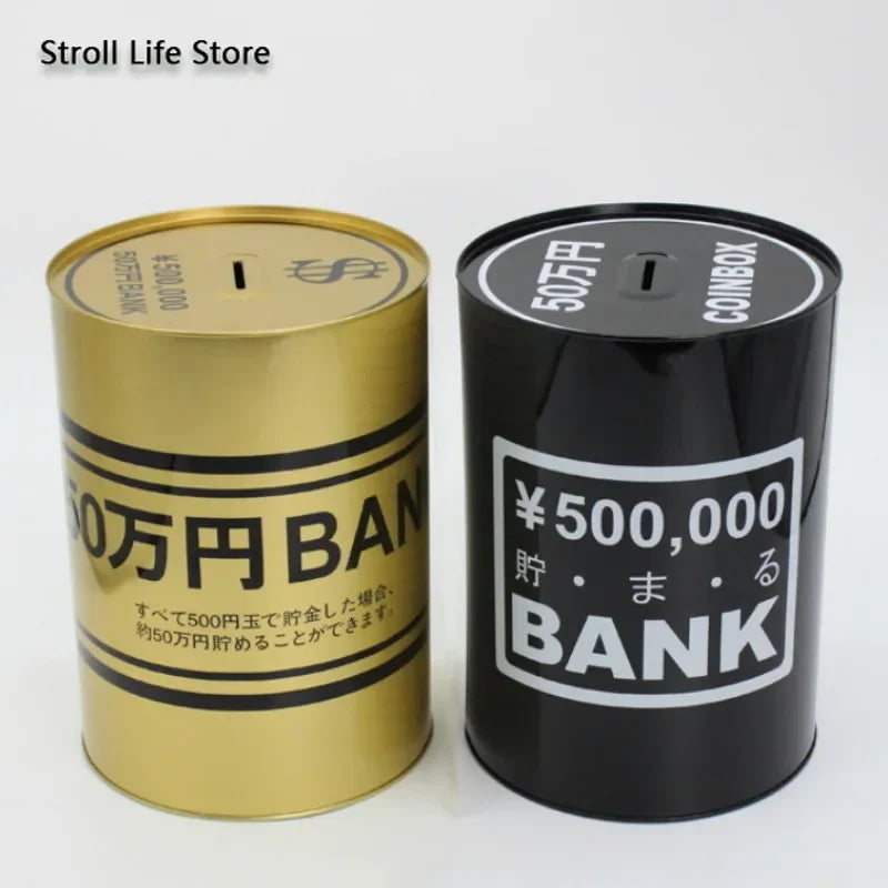 A pair of gold and black metal piggy banks labeled with Japanese text for storing money.