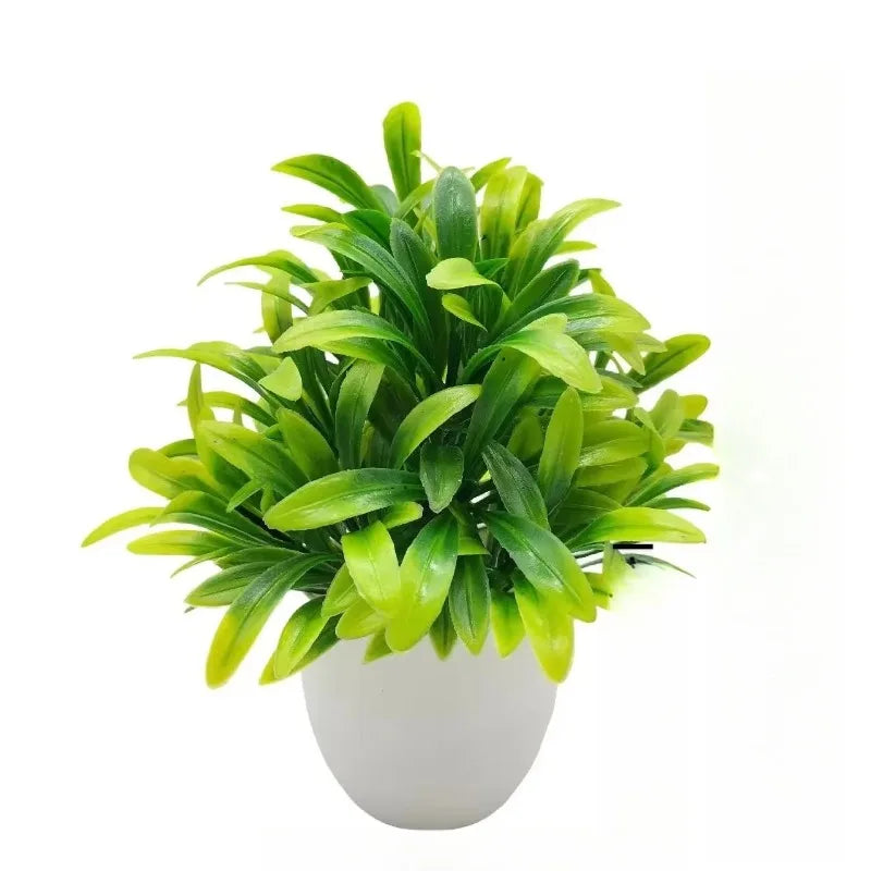 Lebendiges grünes Kunstbonsai-Pflanze in weißem Topf